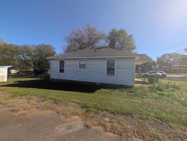 view of home's exterior featuring a yard