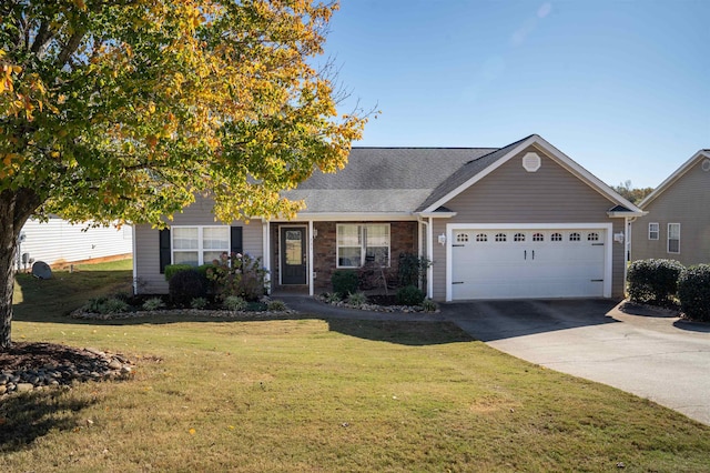 ranch-style house featuring a garage and a front lawn