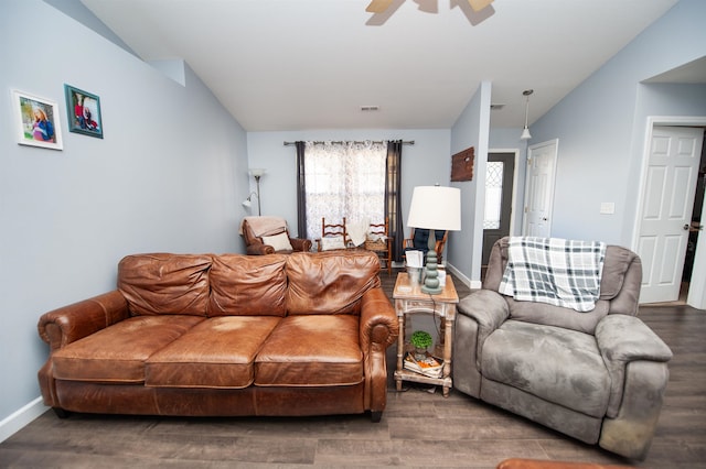 living room featuring dark hardwood / wood-style floors, ceiling fan, and lofted ceiling