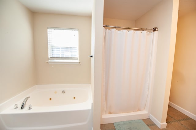 bathroom with tile patterned floors and walk in shower