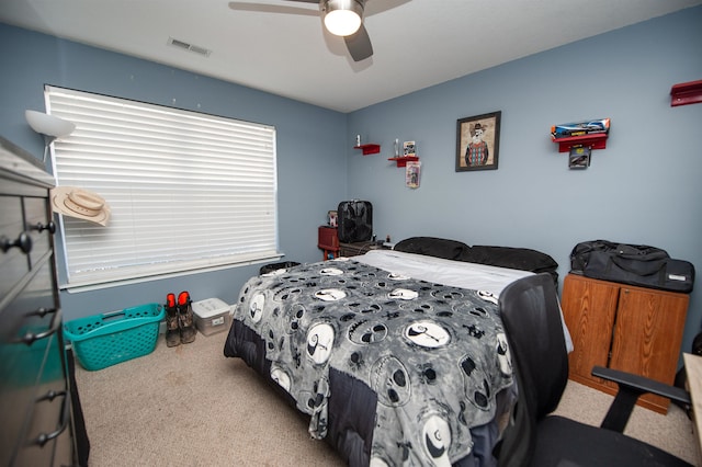 bedroom featuring ceiling fan and light colored carpet