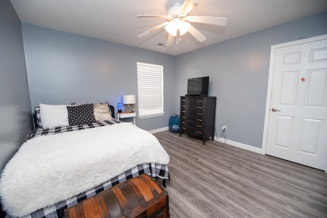 bedroom featuring hardwood / wood-style floors and ceiling fan