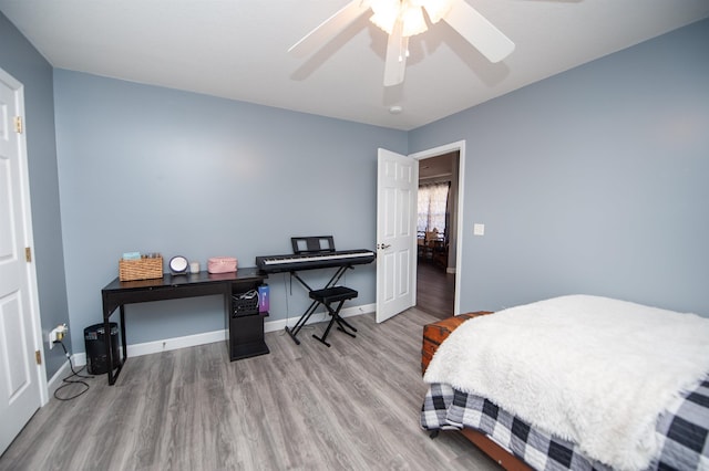 bedroom featuring hardwood / wood-style flooring and ceiling fan