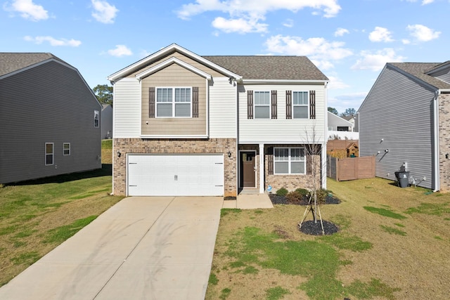 view of front of home with a front yard and a garage