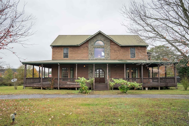 farmhouse inspired home with a front lawn and a porch