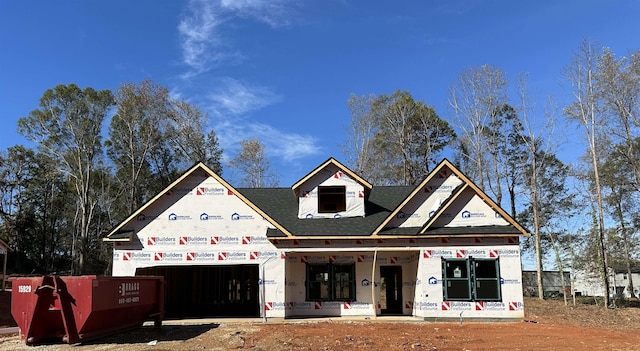 unfinished property featuring an attached garage