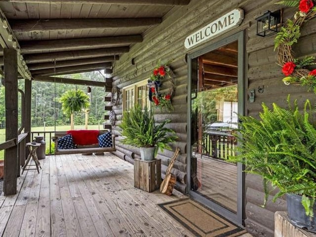 wooden deck featuring covered porch