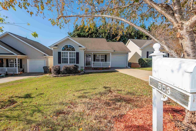 ranch-style house featuring covered porch, a garage, and a front lawn