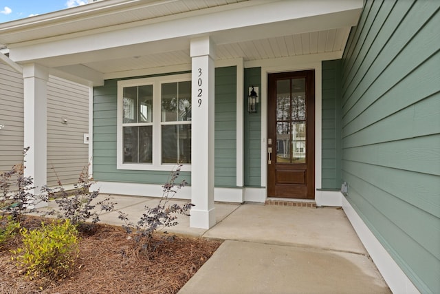 entrance to property featuring covered porch