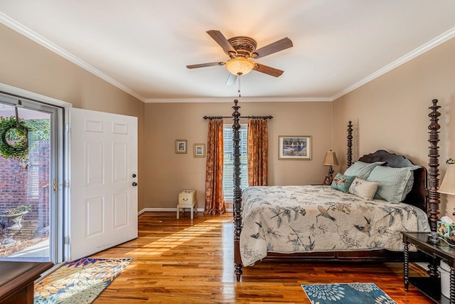 bedroom with access to outside, hardwood / wood-style flooring, multiple windows, and ceiling fan