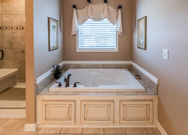 bathroom with tile patterned floors and independent shower and bath