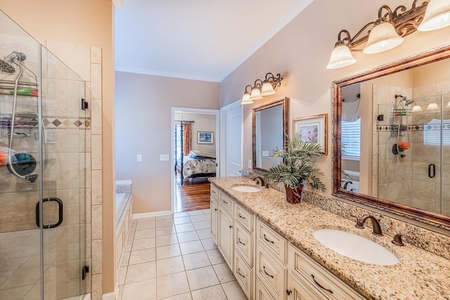 bathroom with tile patterned floors, vanity, ornamental molding, and shower with separate bathtub