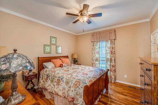 bedroom featuring ceiling fan, crown molding, and hardwood / wood-style flooring