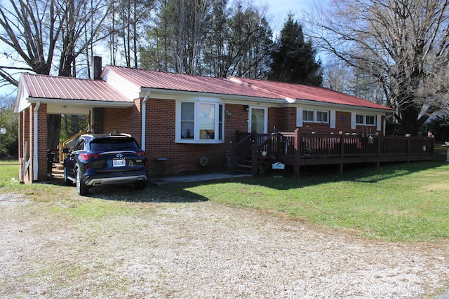 ranch-style house with a front lawn, a deck, and a carport