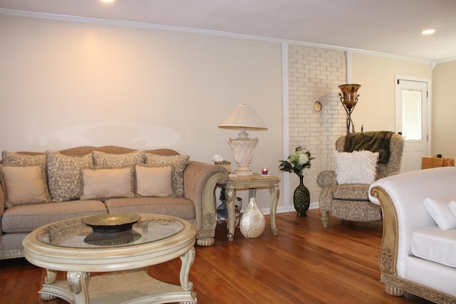 living room with crown molding and dark wood-type flooring