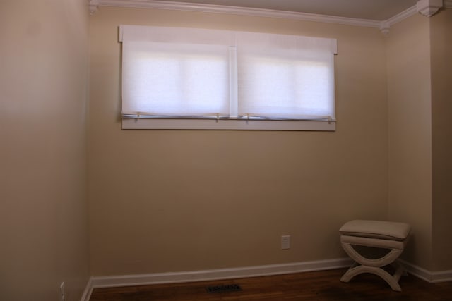 unfurnished room with dark hardwood / wood-style flooring and crown molding