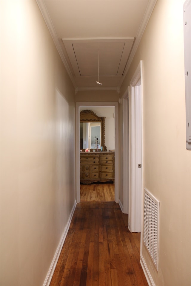 hallway featuring ornamental molding and dark wood-type flooring