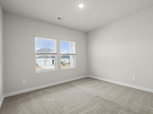 unfurnished room featuring carpet