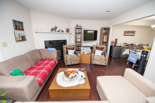 living room featuring dark hardwood / wood-style flooring