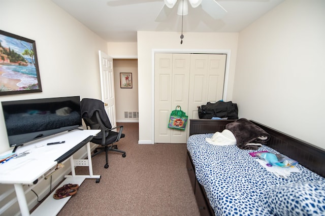 bedroom featuring a closet, ceiling fan, and carpet