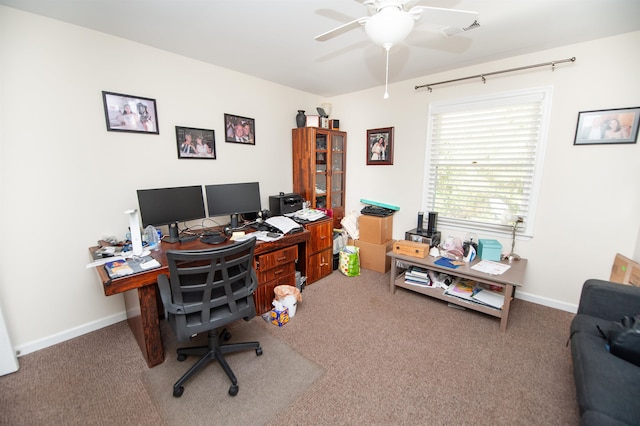 home office with ceiling fan and carpet floors