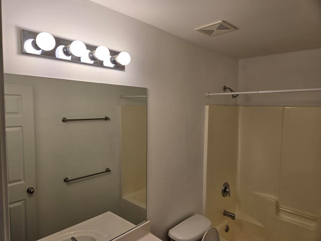 full bathroom featuring bathtub / shower combination, vanity, and toilet