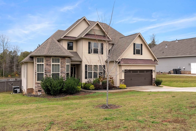 craftsman house featuring central AC, a garage, and a front lawn