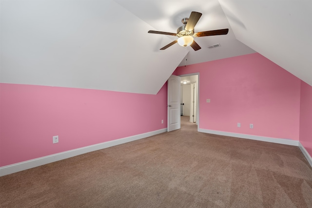 bonus room featuring ceiling fan, carpet, and vaulted ceiling