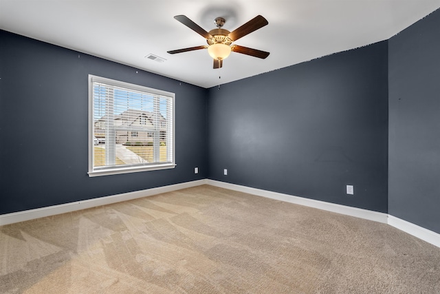 unfurnished room with carpet and ceiling fan