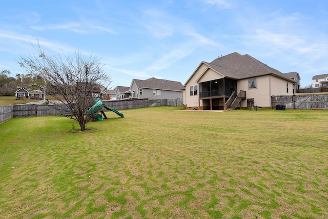 view of yard with a sunroom