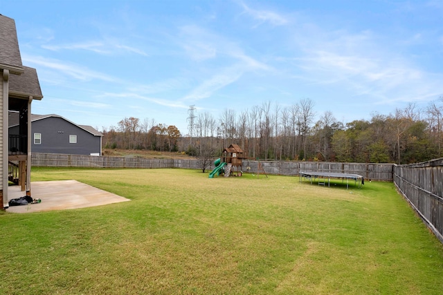 view of yard with a playground, a patio area, and a trampoline