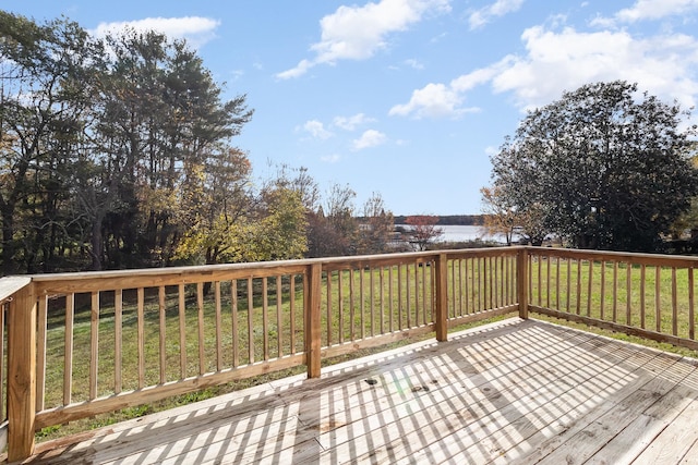 wooden deck featuring a yard