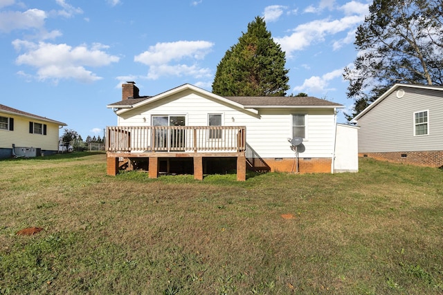 rear view of property with a chimney, crawl space, a lawn, and a deck