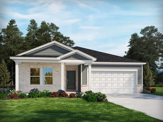 view of front of property featuring a front yard and a garage