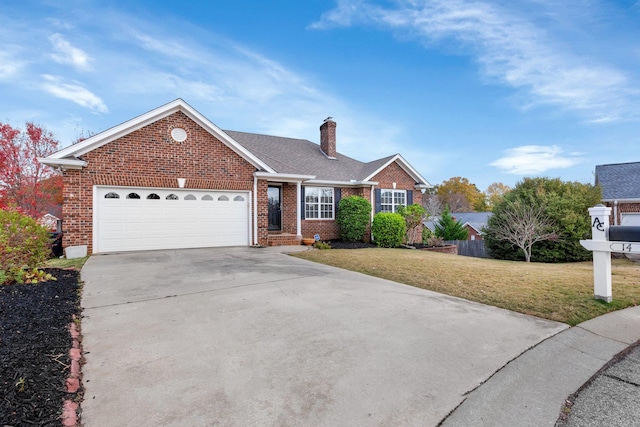 view of front of home with a garage and a front lawn