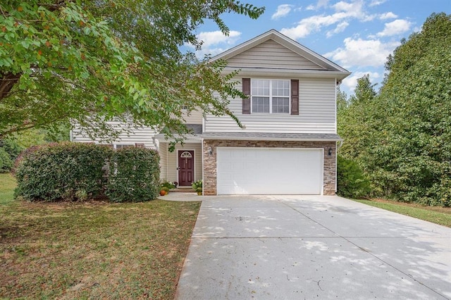 view of front property with a front yard and a garage