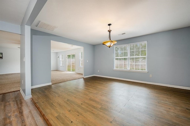 unfurnished room featuring hardwood / wood-style flooring