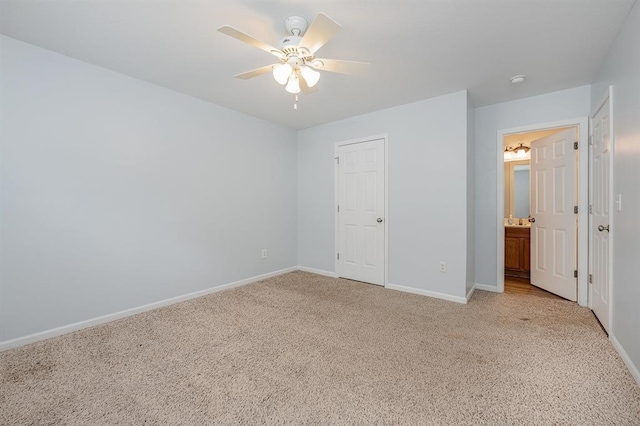 unfurnished bedroom featuring a closet, light colored carpet, and ceiling fan