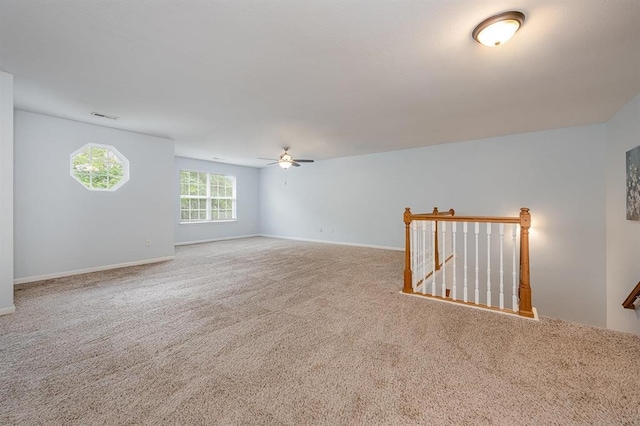 carpeted empty room with ceiling fan