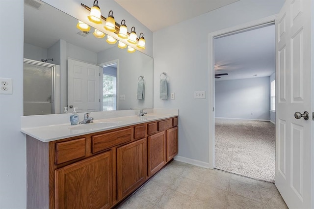 bathroom with tile patterned flooring, vanity, ceiling fan, and a shower with shower door