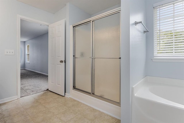 bathroom with plus walk in shower and a wealth of natural light