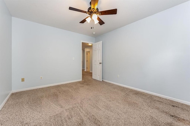 empty room featuring carpet and ceiling fan