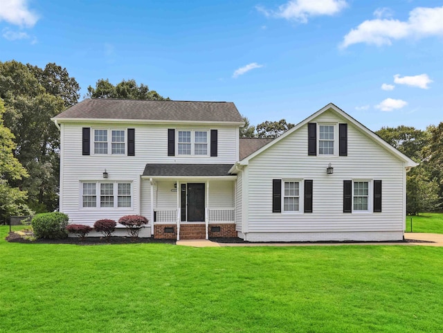 view of front of property with a porch and a front yard