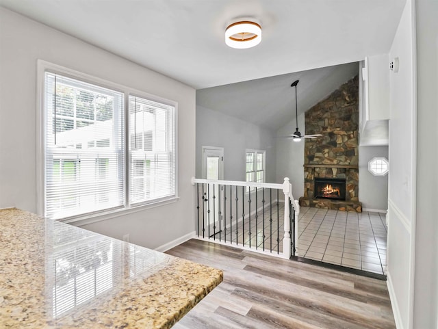 interior space featuring hardwood / wood-style floors and lofted ceiling