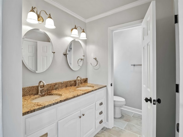 bathroom with crown molding, vanity, and toilet