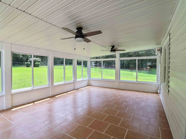 unfurnished sunroom featuring ceiling fan