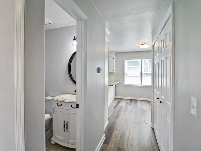 corridor featuring hardwood / wood-style flooring