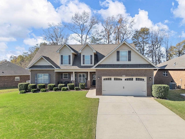 craftsman inspired home featuring central AC unit, a garage, and a front lawn