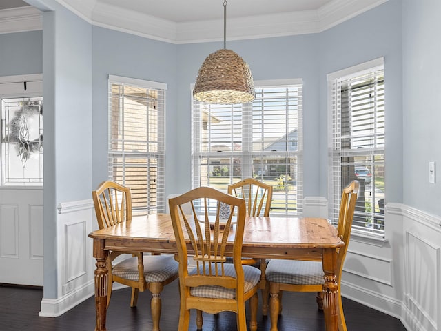 dining area featuring ornamental molding, dark hardwood / wood-style floors, and a healthy amount of sunlight