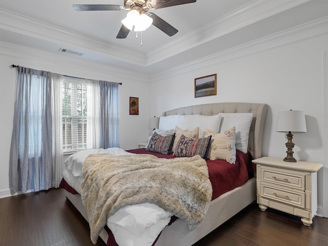 bedroom with ceiling fan, dark hardwood / wood-style flooring, and ornamental molding